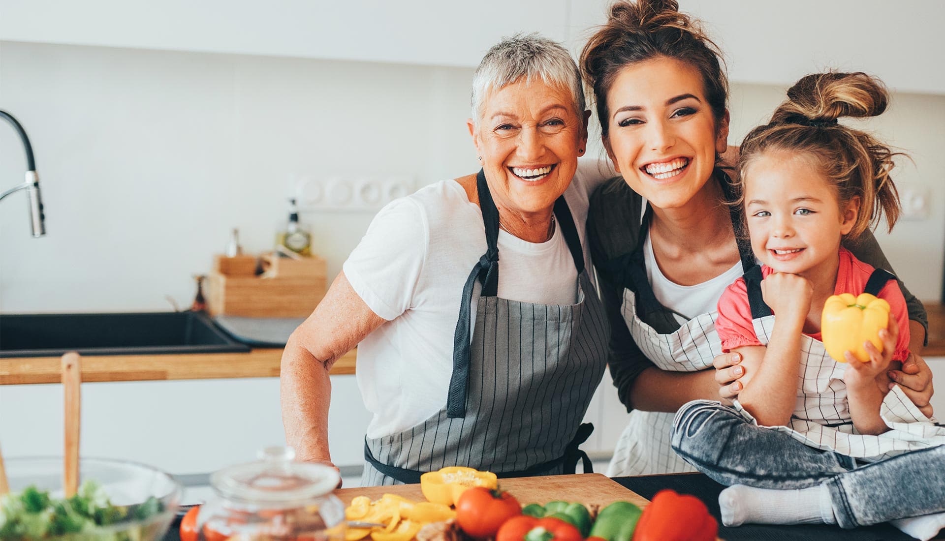 family generations of women cooking together