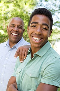 smiling father and son